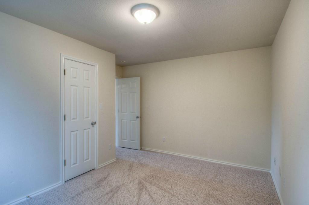14813 Jacks Pond Road Austin, TX 78728 - Photo 7 of 29 Neutral-toned room featuring carpeted flooring and a flush-mount ceiling light fixture