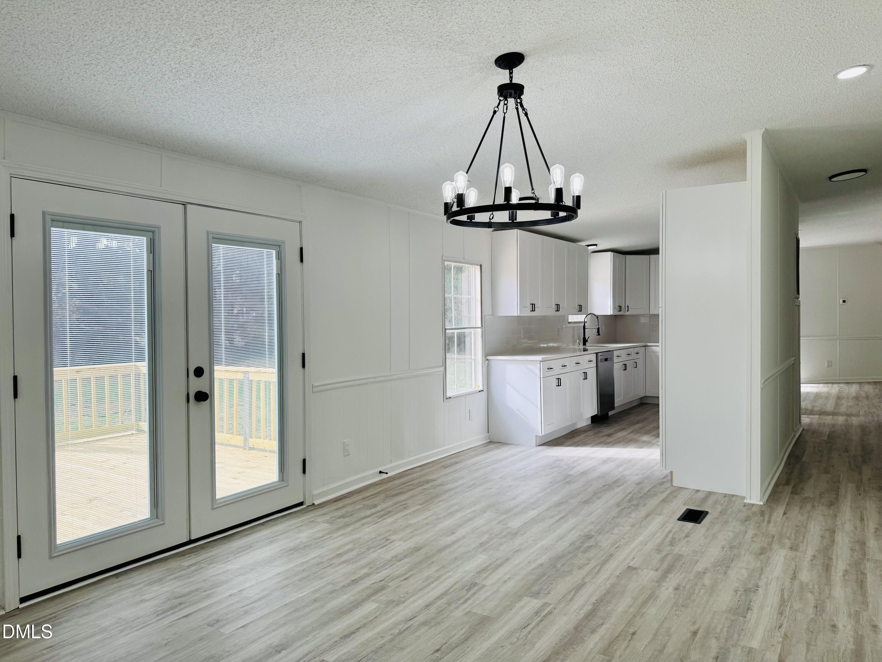 128 Lisa Cheryl Lane Roxboro, NC 27573 - Photo 12 of 23 a view of a kitchen with a sink wooden floor and a window