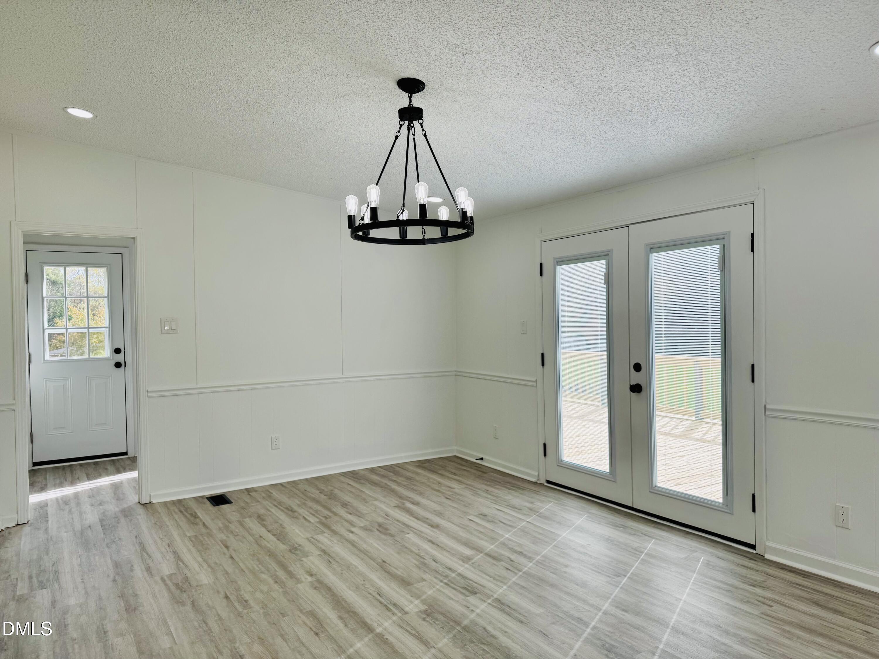 128 Lisa Cheryl Lane Roxboro, NC 27573 - Photo 13 of 23 a view of a room with wooden floor and white walls