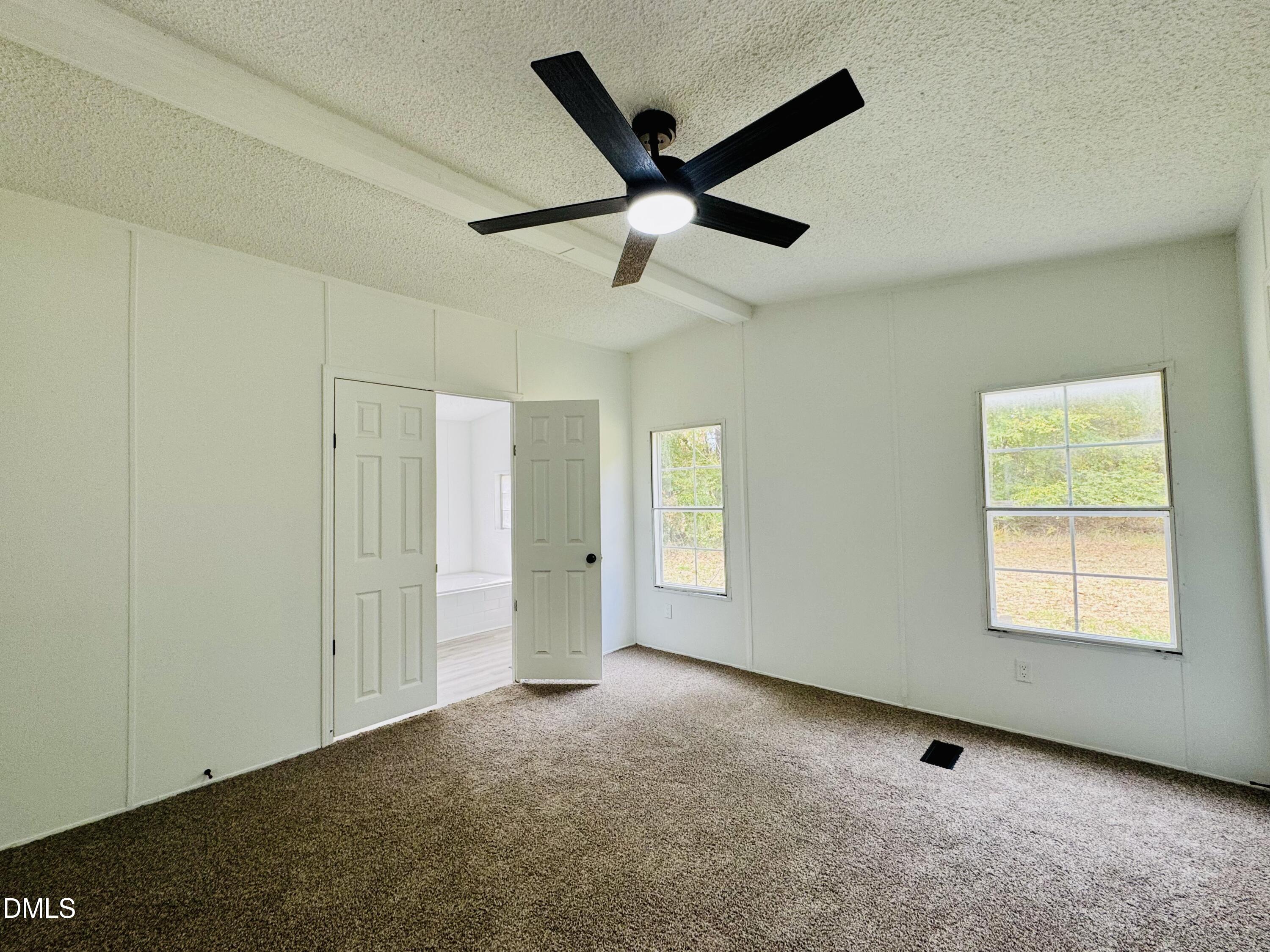 128 Lisa Cheryl Lane Roxboro, NC 27573 - Photo 14 of 23 a view of an empty room with a window