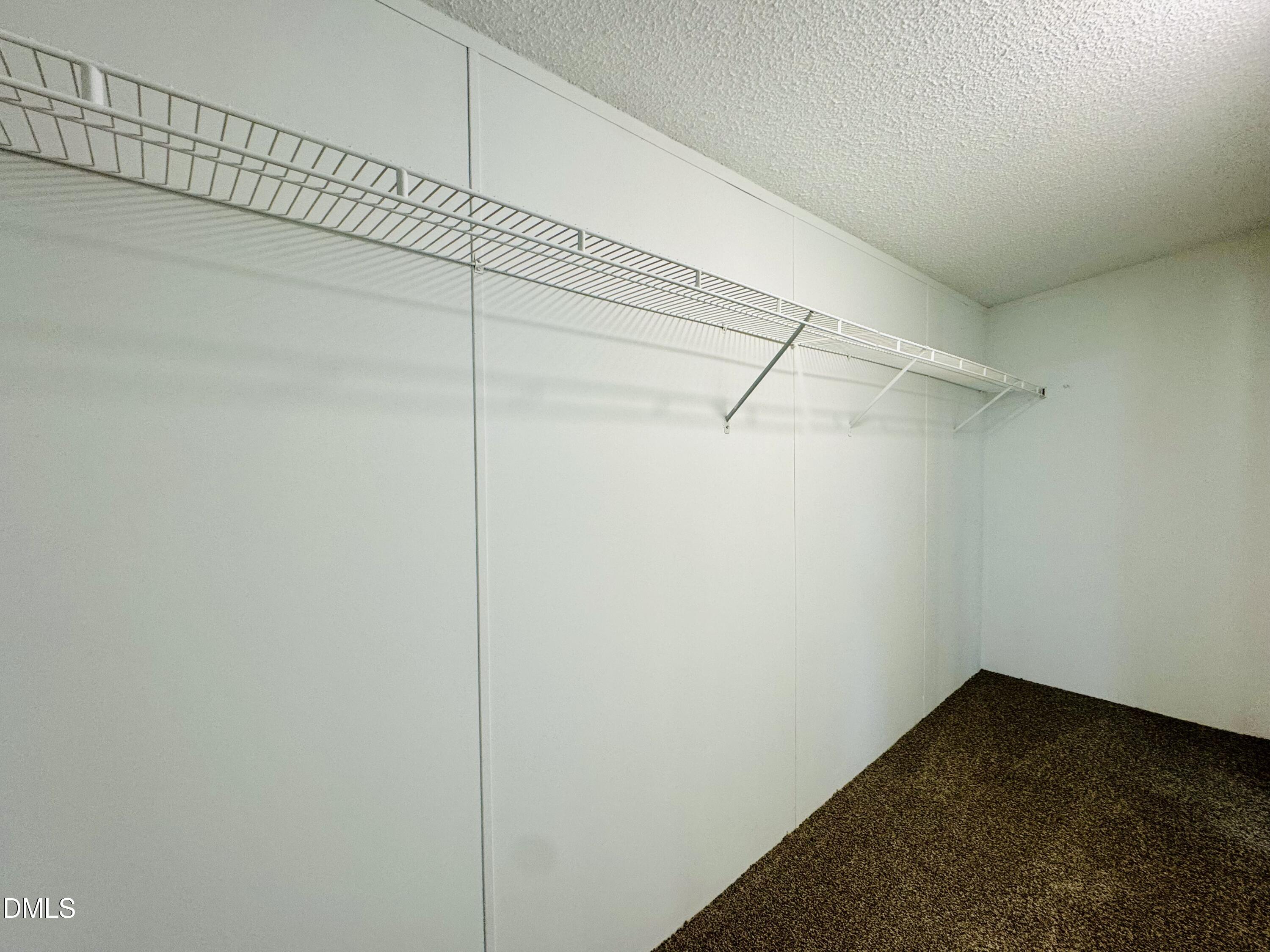 128 Lisa Cheryl Lane Roxboro, NC 27573 - Photo 16 of 23 a view of a room with racks on the wall
