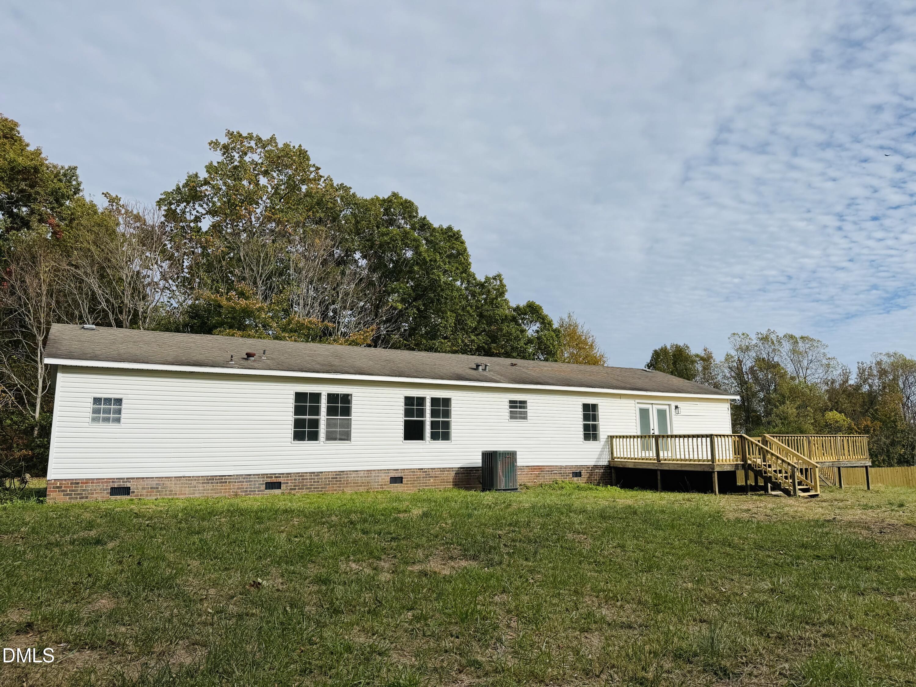 128 Lisa Cheryl Lane Roxboro, NC 27573 - Photo 3 of 23 a view of a house with backyard and garden