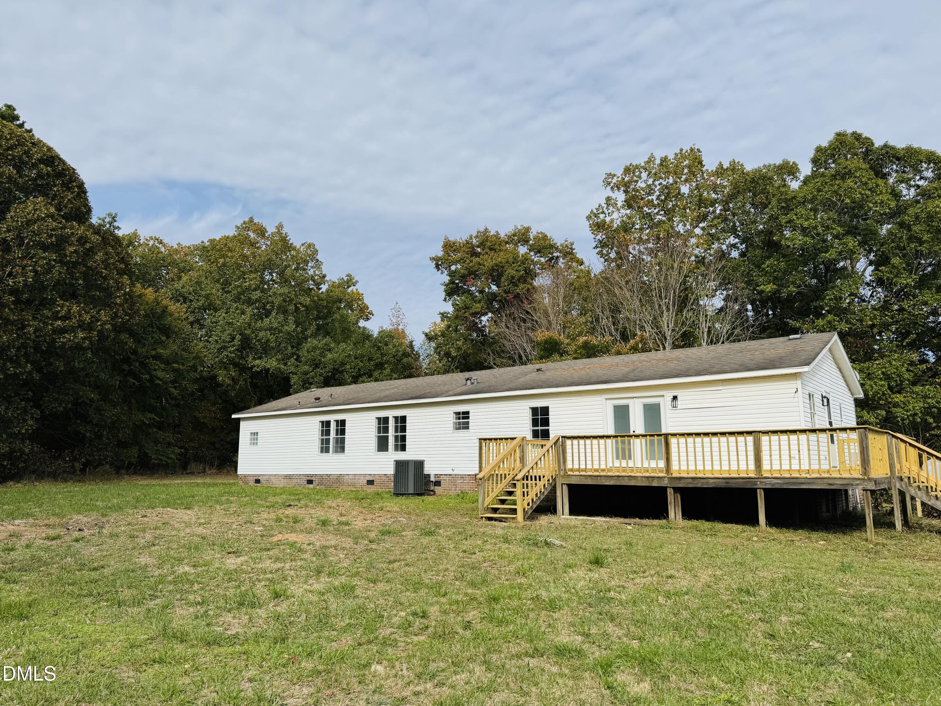 128 Lisa Cheryl Lane Roxboro, NC 27573 - Photo 4 of 23 a view of a house with a yard