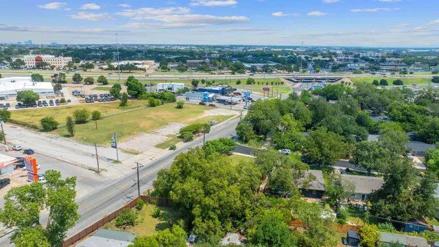 an aerial view of a house with a lake view