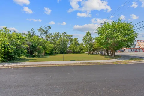 a view of a golf course with a lake view