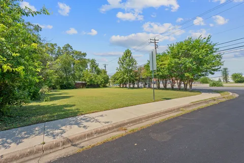 a backyard of a house with lots of green space