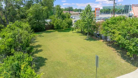 a view of outdoor space with deck and trees