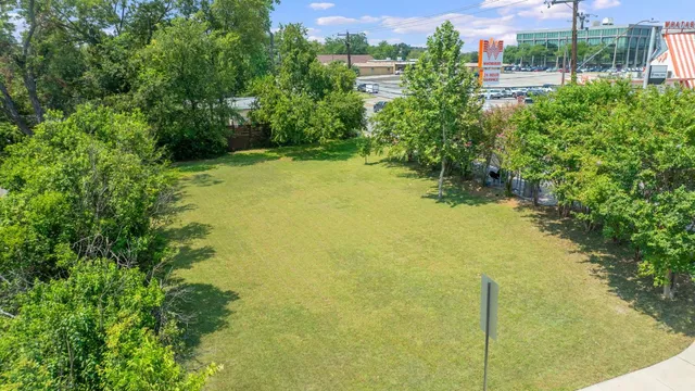 a view of outdoor space with deck and trees
