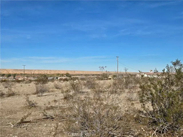 a view of a beach with a ocean view