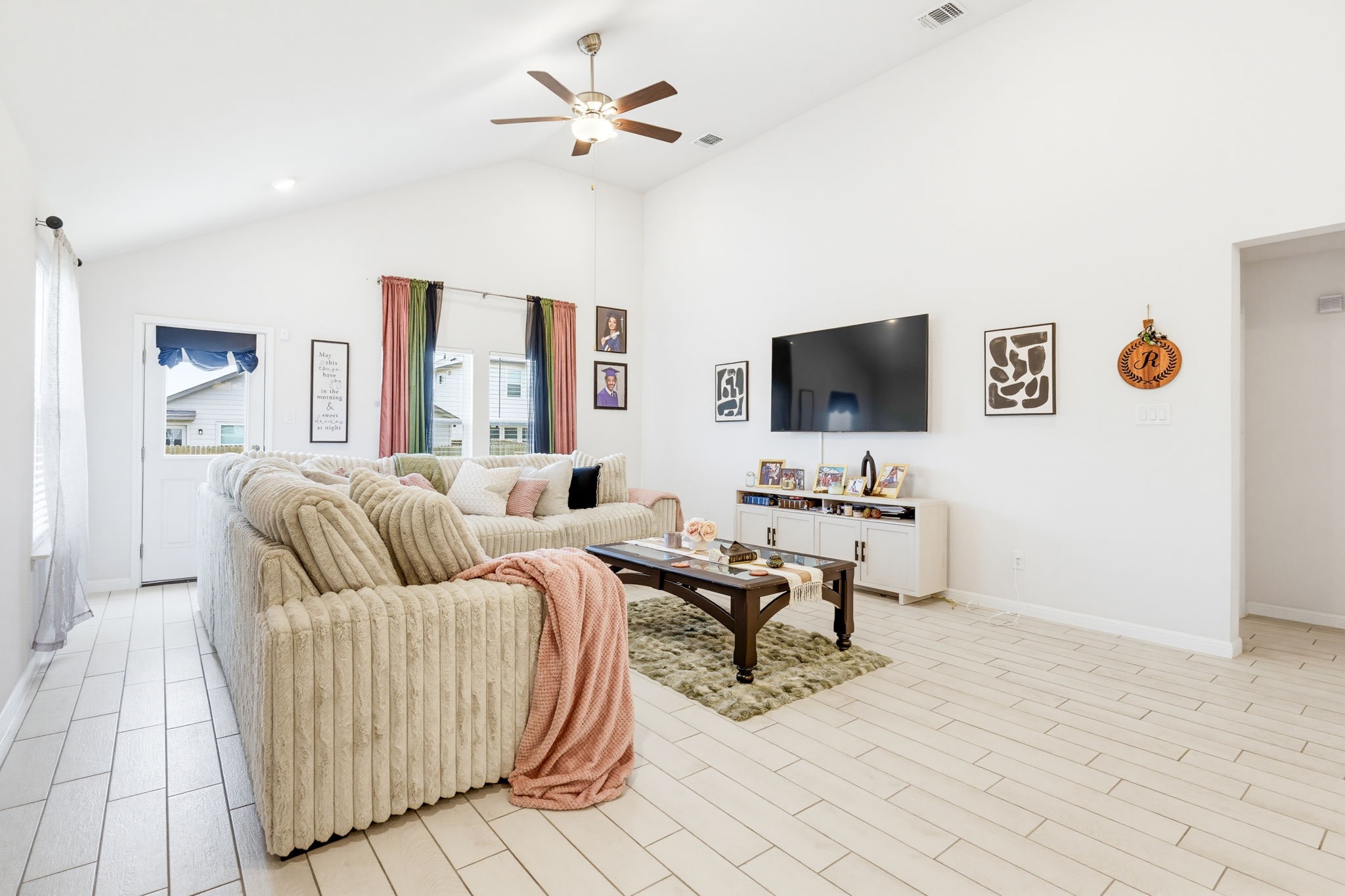 316 Windstar Road Liberty Hill, TX 78642 - Photo 10 of 27 a living room with furniture and a flat screen tv