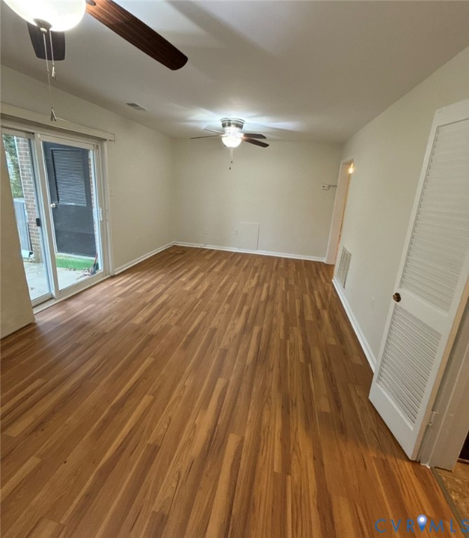 1515 Presidential Drive Henrico, VA 23228 - Photo 12 of 21 wooden floor in an empty room with a window