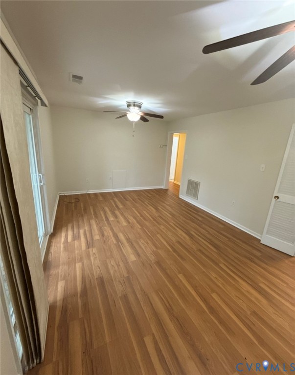 1515 Presidential Drive Henrico, VA 23228 - Photo 13 of 21 wooden floor in an empty room with a window