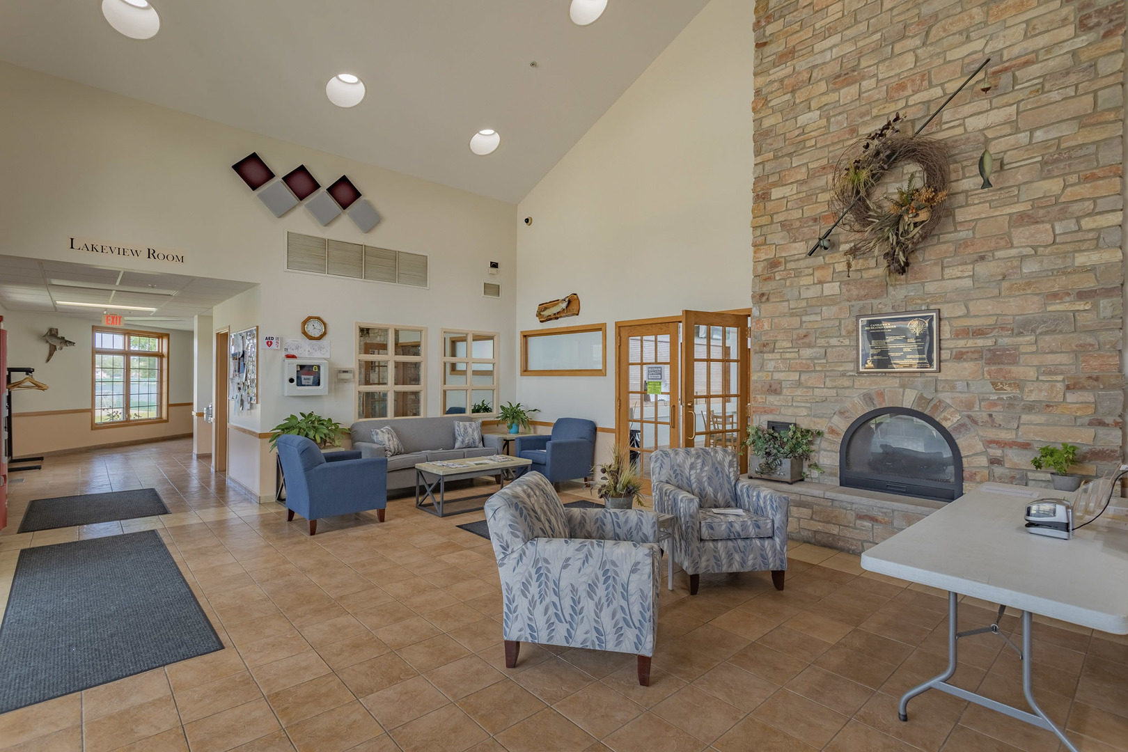 416 Benedict Drive Southwest Poplar Grove, IL 61065 - Photo 30 of 30 a living room with fireplace furniture and a potted plant