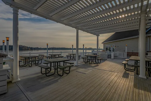 a view of a patio with table and chairs with wooden floor