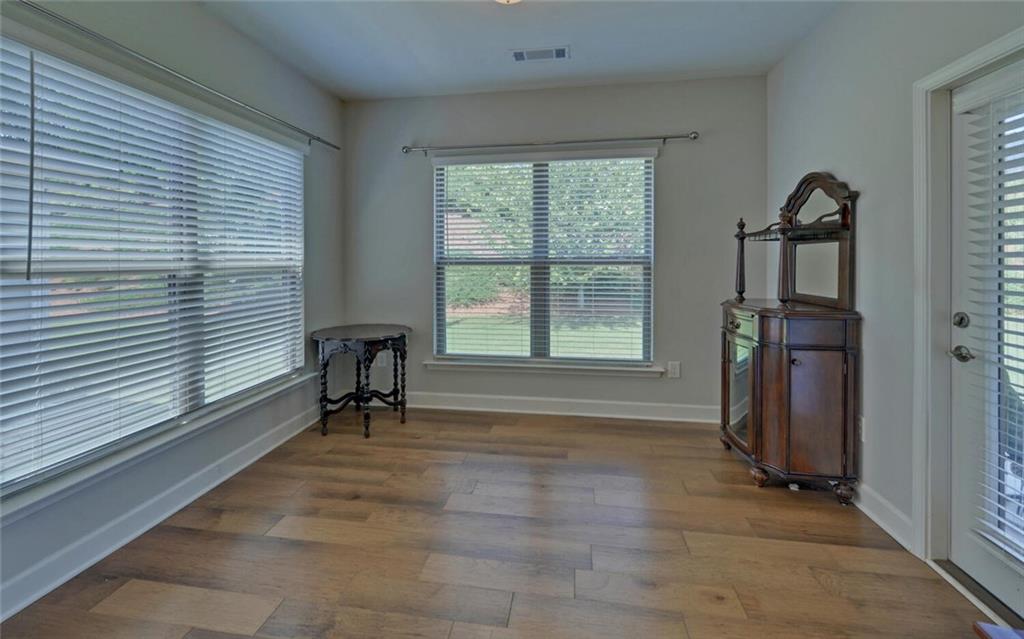 5825 Maple Bluff Way Hoschton, GA 30548 - Photo 21 of 67 a view of a livingroom with furniture and a window