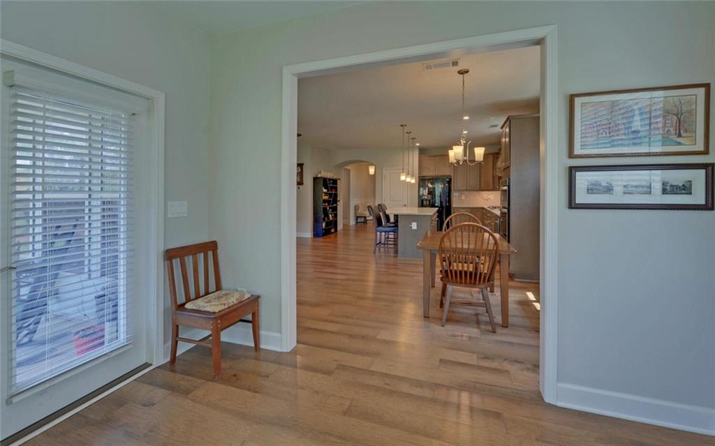 5825 Maple Bluff Way Hoschton, GA 30548 - Photo 23 of 67 a lobby with furniture and a rug