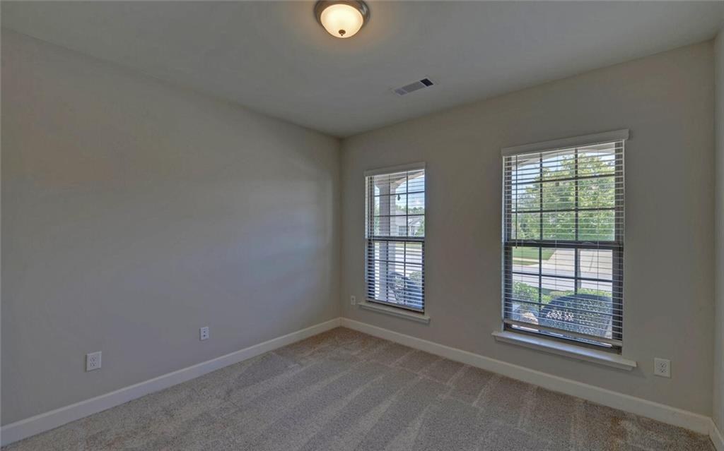 5825 Maple Bluff Way Hoschton, GA 30548 - Photo 34 of 67 a view of an empty room with a window