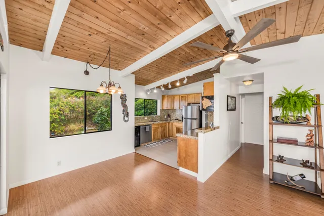 a view of a livingroom with furniture and a ceiling fan