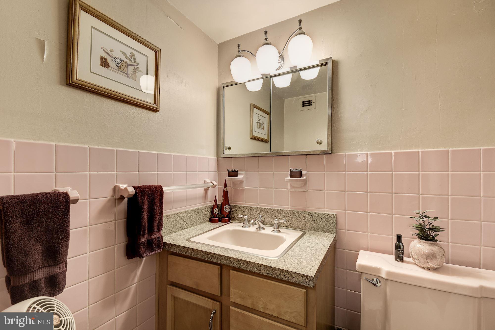 1425 4th Street Southwest, Unit 317 Washington, DC 20024 - Photo 13 of 23 a bathroom with a sink and a mirror