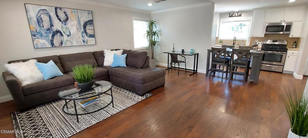 2250 Magnolia Street Simi Valley, CA 93065 - Photo 1 of 14 a living room with furniture a dining table and kitchen view with wooden floor