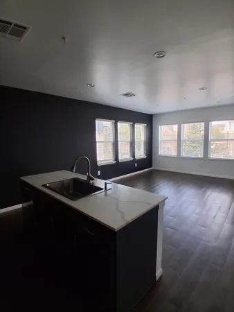 a kitchen with sink and window