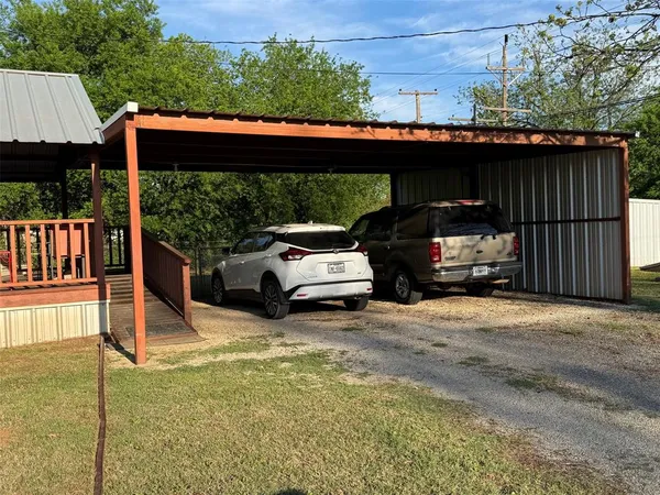 a view of a car parked in the parking lot