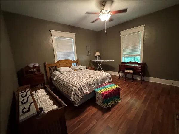 a bedroom with bed and window