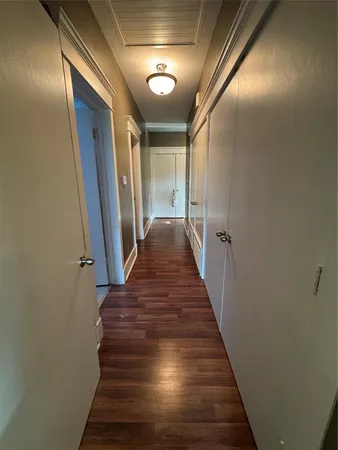 a view of gallery with wooden floor