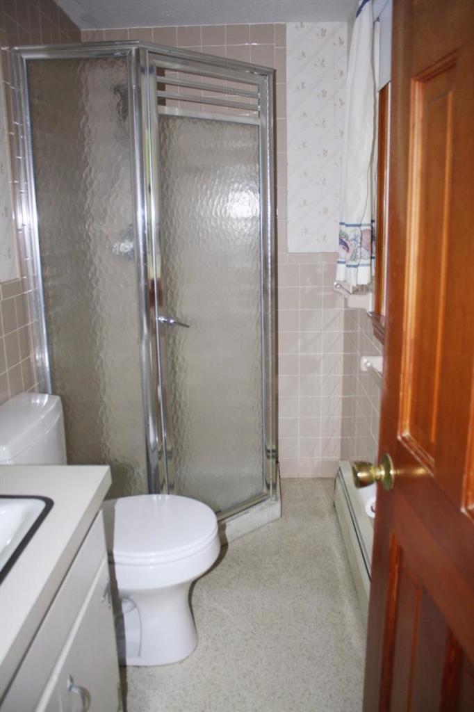 33 Goose Point Road Centerville, MA 02601 - Photo 14 of 29 a bathroom with a shower a toilet and a sink