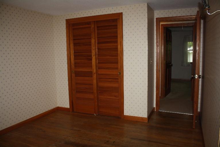 33 Goose Point Road Centerville, MA 02601 - Photo 19 of 29 an empty room with wooden floor closet and windows