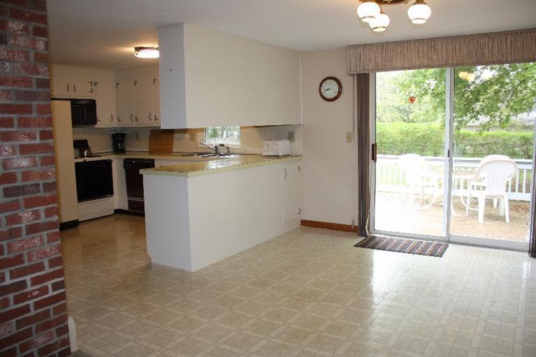 33 Goose Point Road Centerville, MA 02601 - Photo 8 of 29 a kitchen with a refrigerator and a stove