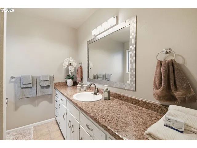 a bathroom with a shower and a sink