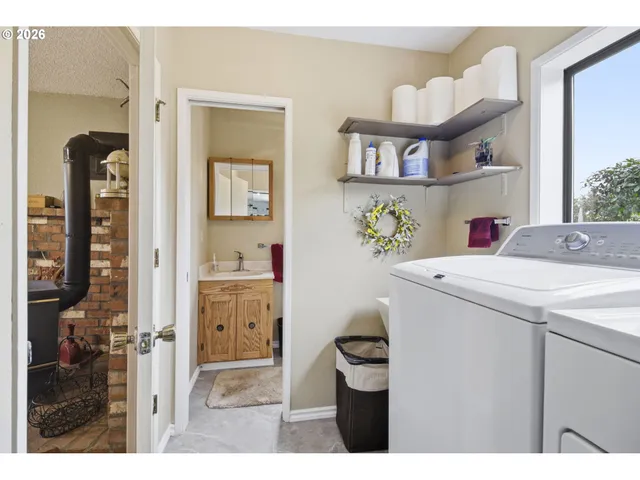 a bathroom with a sink mirror and toilet