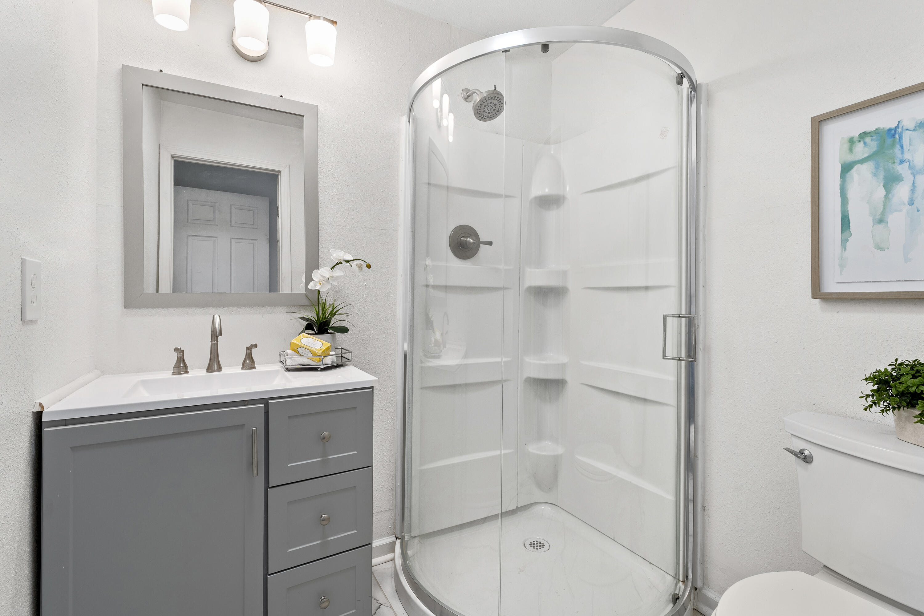 4820 39th Street Lubbock, TX 79414 - Photo 12 of 21 a bathroom with a sink a toilet and shower