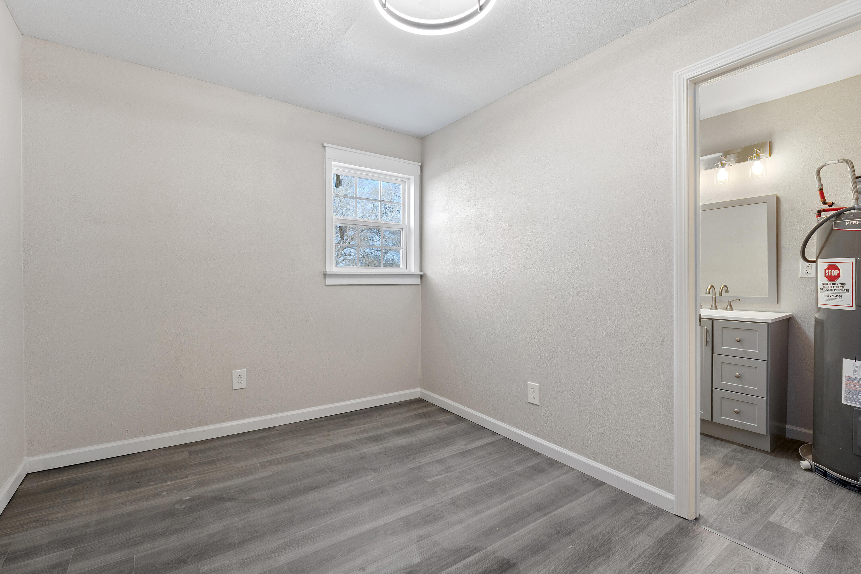 4820 39th Street Lubbock, TX 79414 - Photo 18 of 21 an empty room with a bathroom and a sink