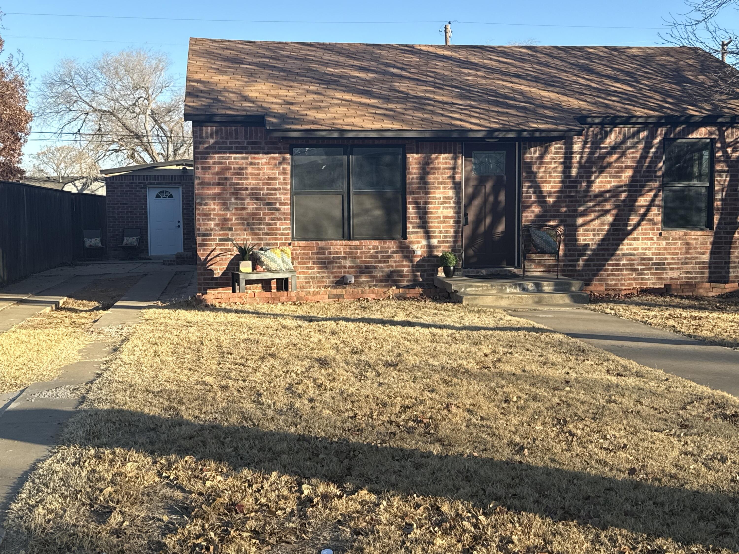 4820 39th Street Lubbock, TX 79414 - Photo 2 of 21 a view of a house with a yard