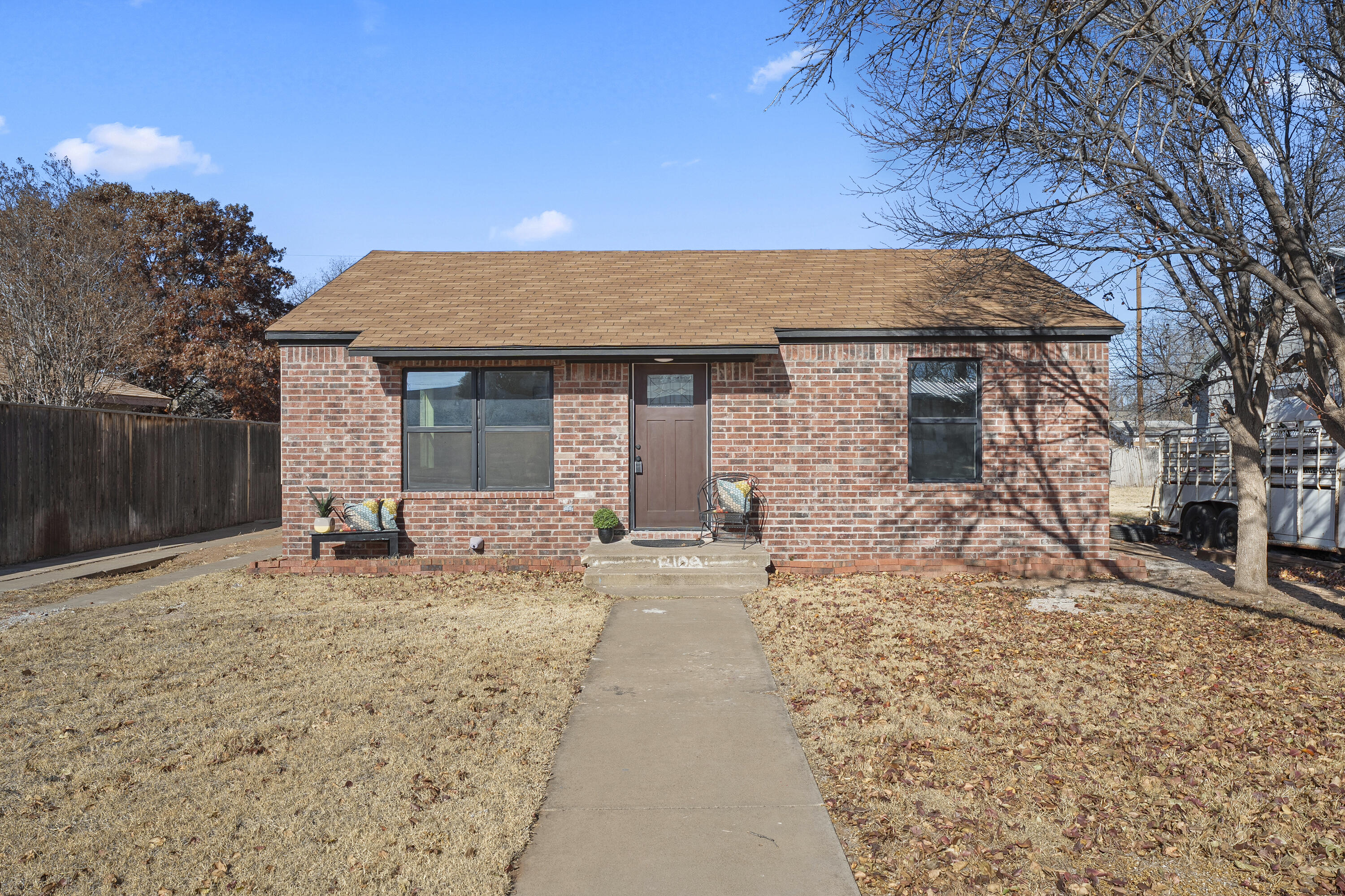 4820 39th Street Lubbock, TX 79414 - Photo 21 of 21 a front view of a house with a yard and garage