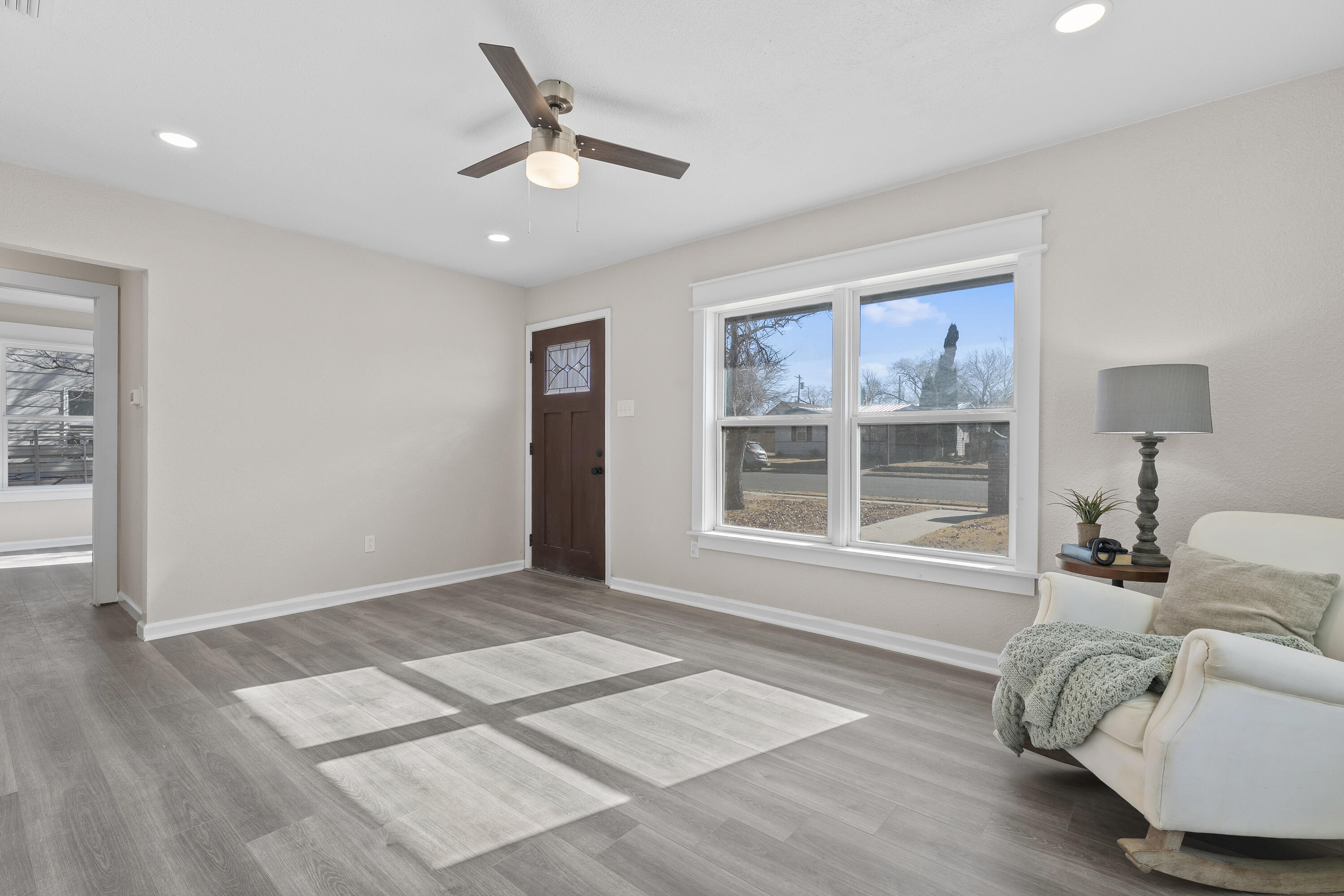 4820 39th Street Lubbock, TX 79414 - Photo 4 of 21 a living room with furniture and a large window