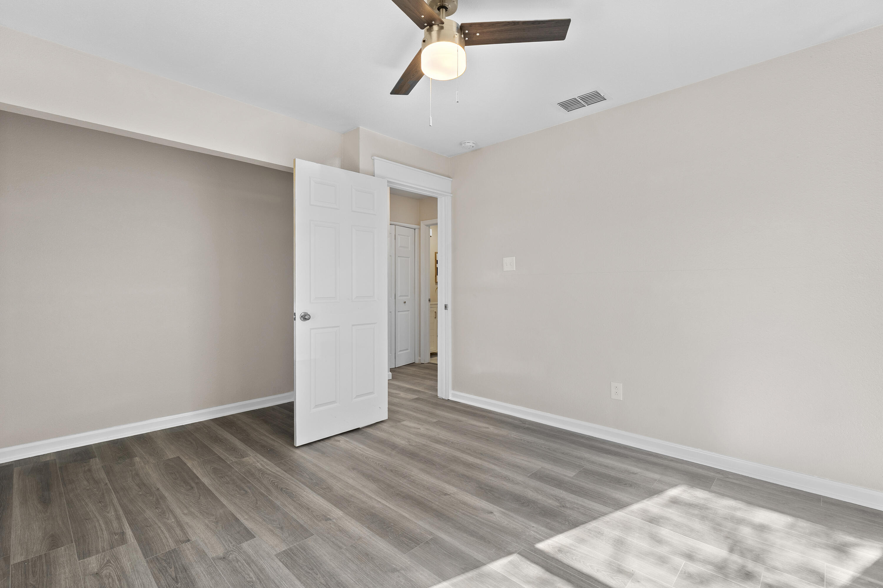 4820 39th Street Lubbock, TX 79414 - Photo 8 of 21 wooden floor in an empty room