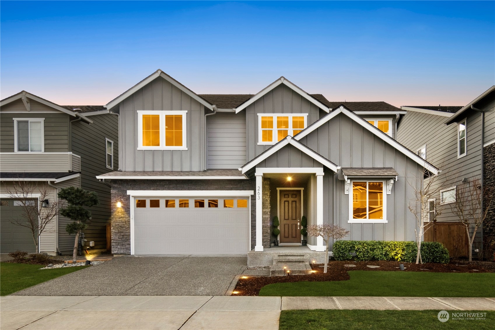 a front view of a house with yard