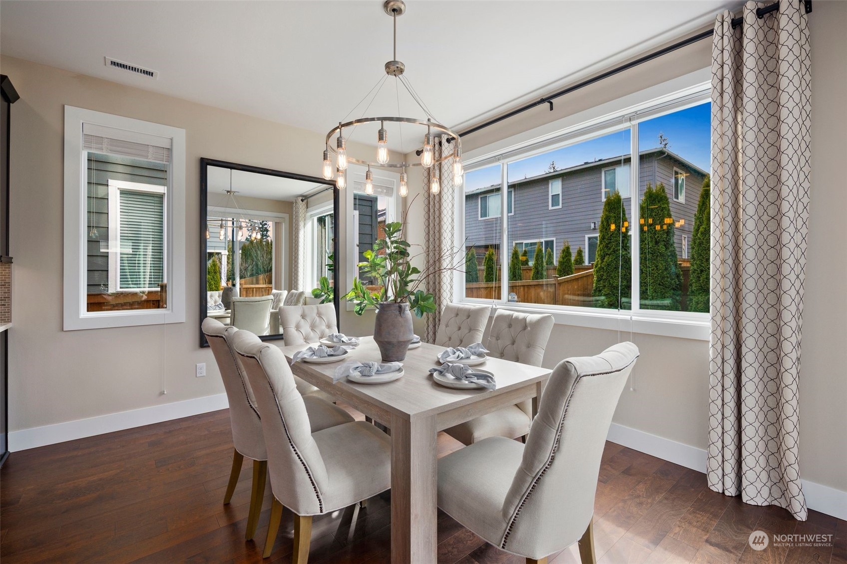 263 Graham Avenue Southeast Renton, WA 98059 - Photo 11 of 40 a view of a dining room with furniture wooden floor and chandelier