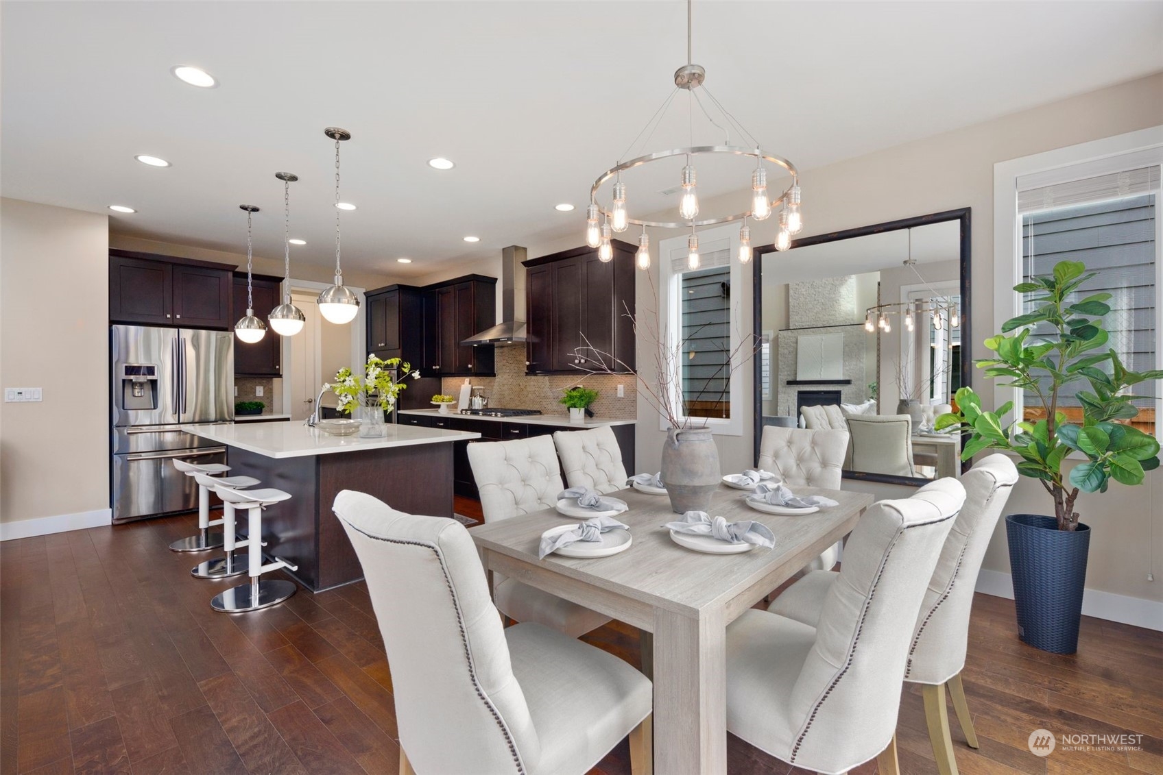 263 Graham Avenue Southeast Renton, WA 98059 - Photo 12 of 40 a dining room with stainless steel appliances kitchen island granite countertop furniture and a kitchen view