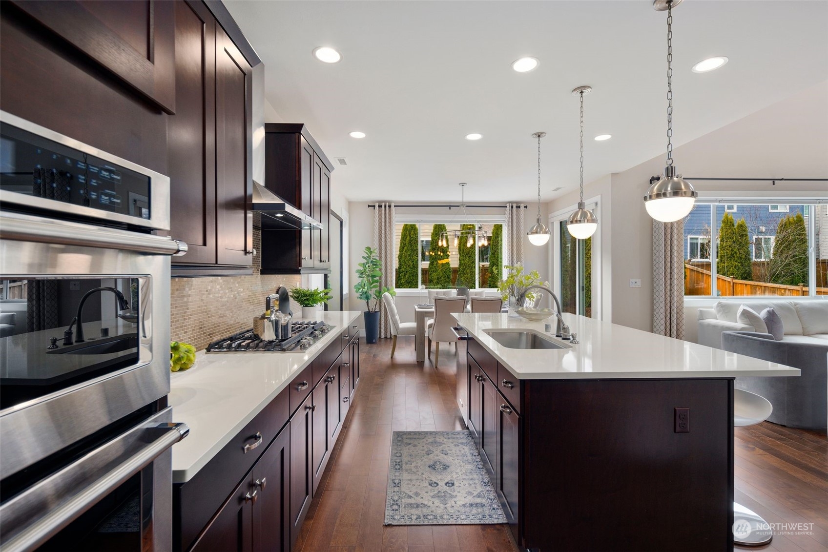 263 Graham Avenue Southeast Renton, WA 98059 - Photo 13 of 40 a kitchen with lots of counter space a sink and appliances