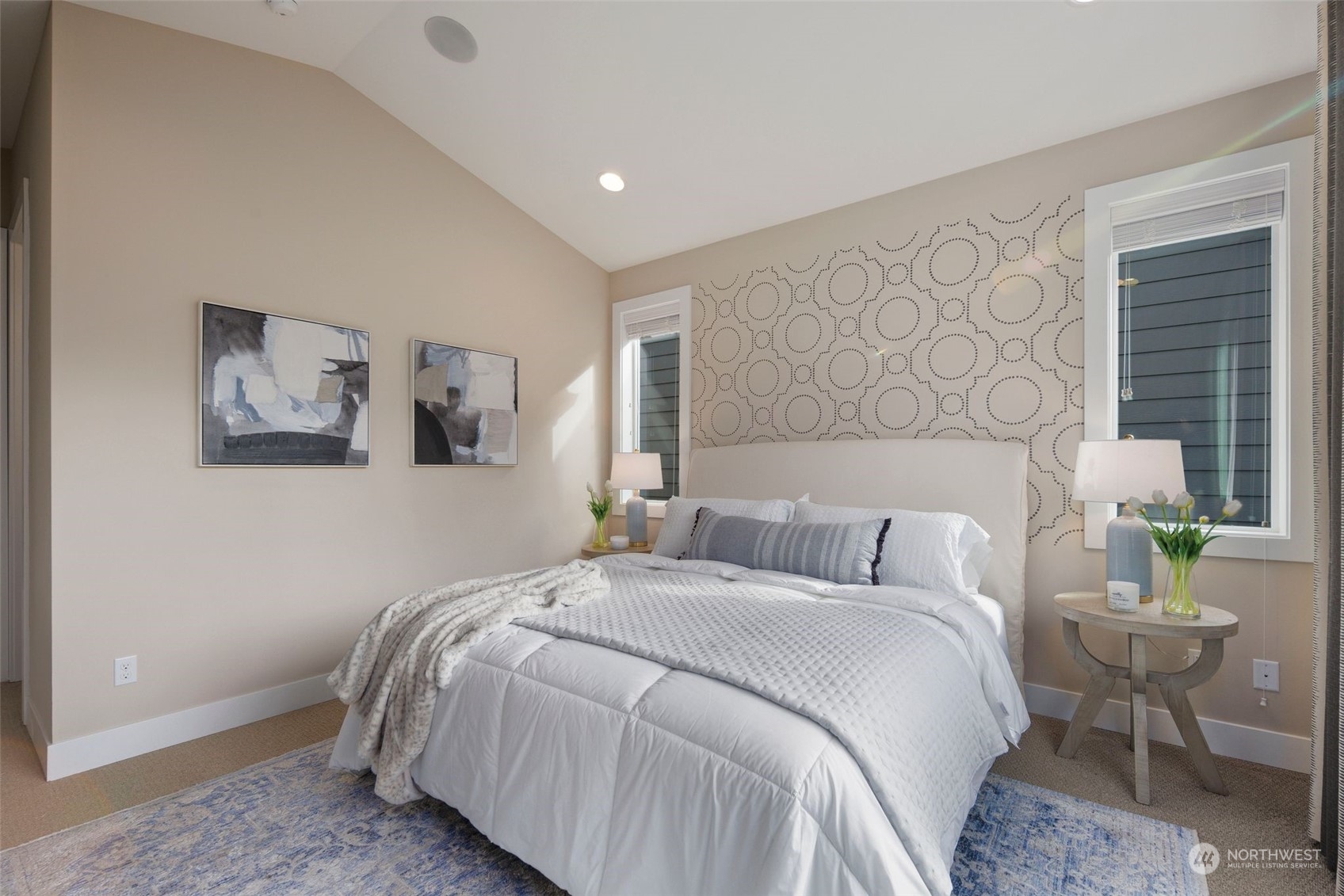 263 Graham Avenue Southeast Renton, WA 98059 - Photo 16 of 40 a bedroom with a bed and painting on the wall