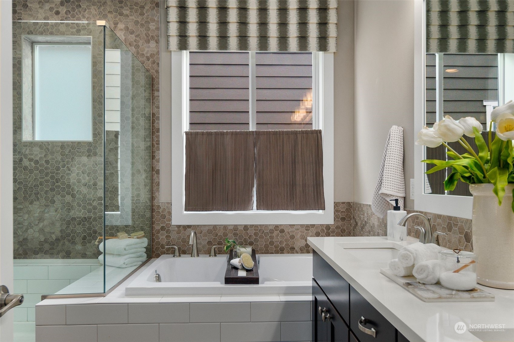 263 Graham Avenue Southeast Renton, WA 98059 - Photo 18 of 40 a bathroom with a granite countertop sink and a bathtub
