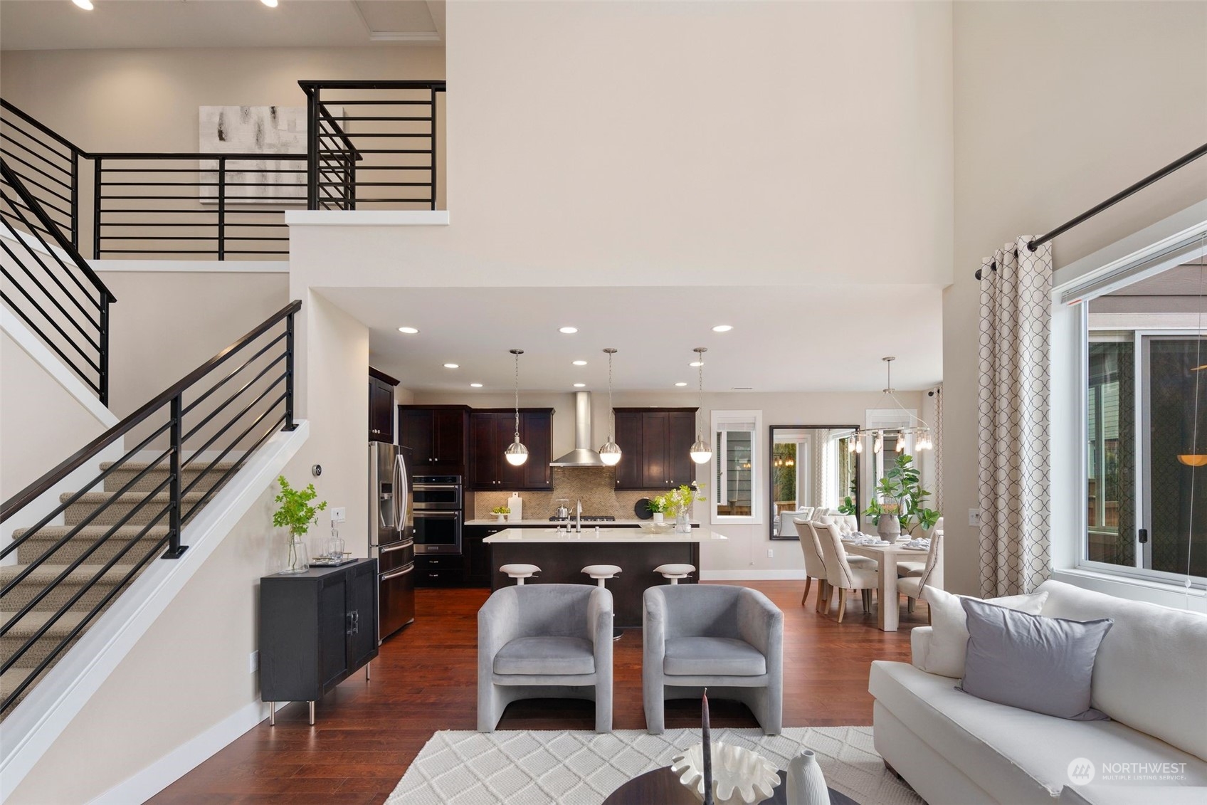 263 Graham Avenue Southeast Renton, WA 98059 - Photo 4 of 40 a living room with furniture kitchen view and a large window