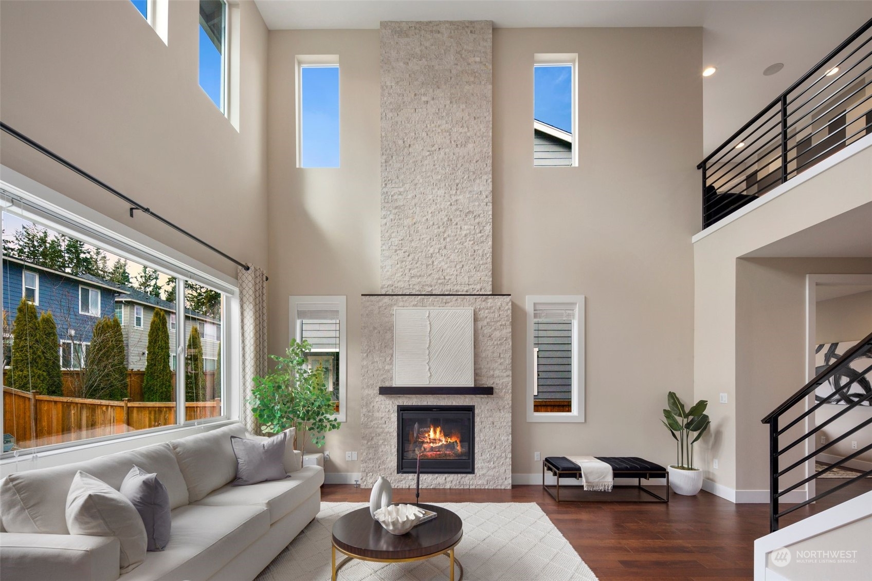 263 Graham Avenue Southeast Renton, WA 98059 - Photo 5 of 40 a living room with furniture a fireplace and a large window
