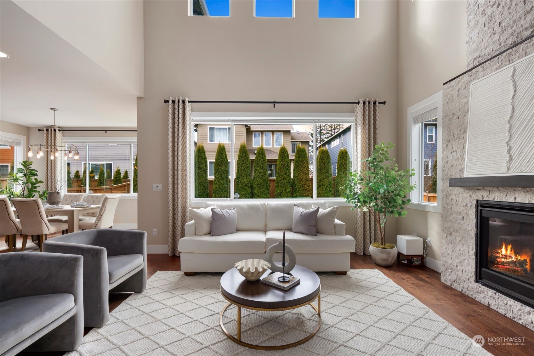 263 Graham Avenue Southeast Renton, WA 98059 - Photo 6 of 40 a living room with furniture a fireplace and a large window