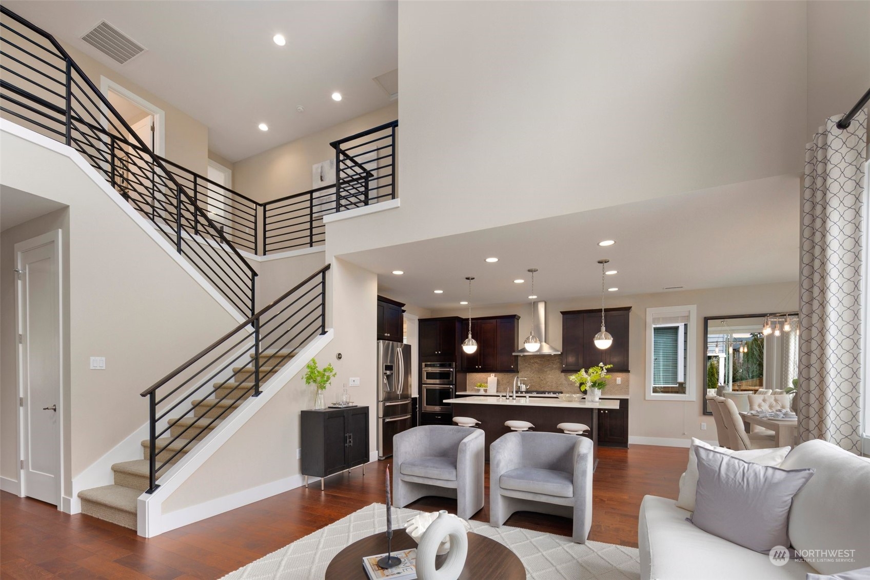263 Graham Avenue Southeast Renton, WA 98059 - Photo 7 of 40 a living room with furniture and kitchen view with wooden floor