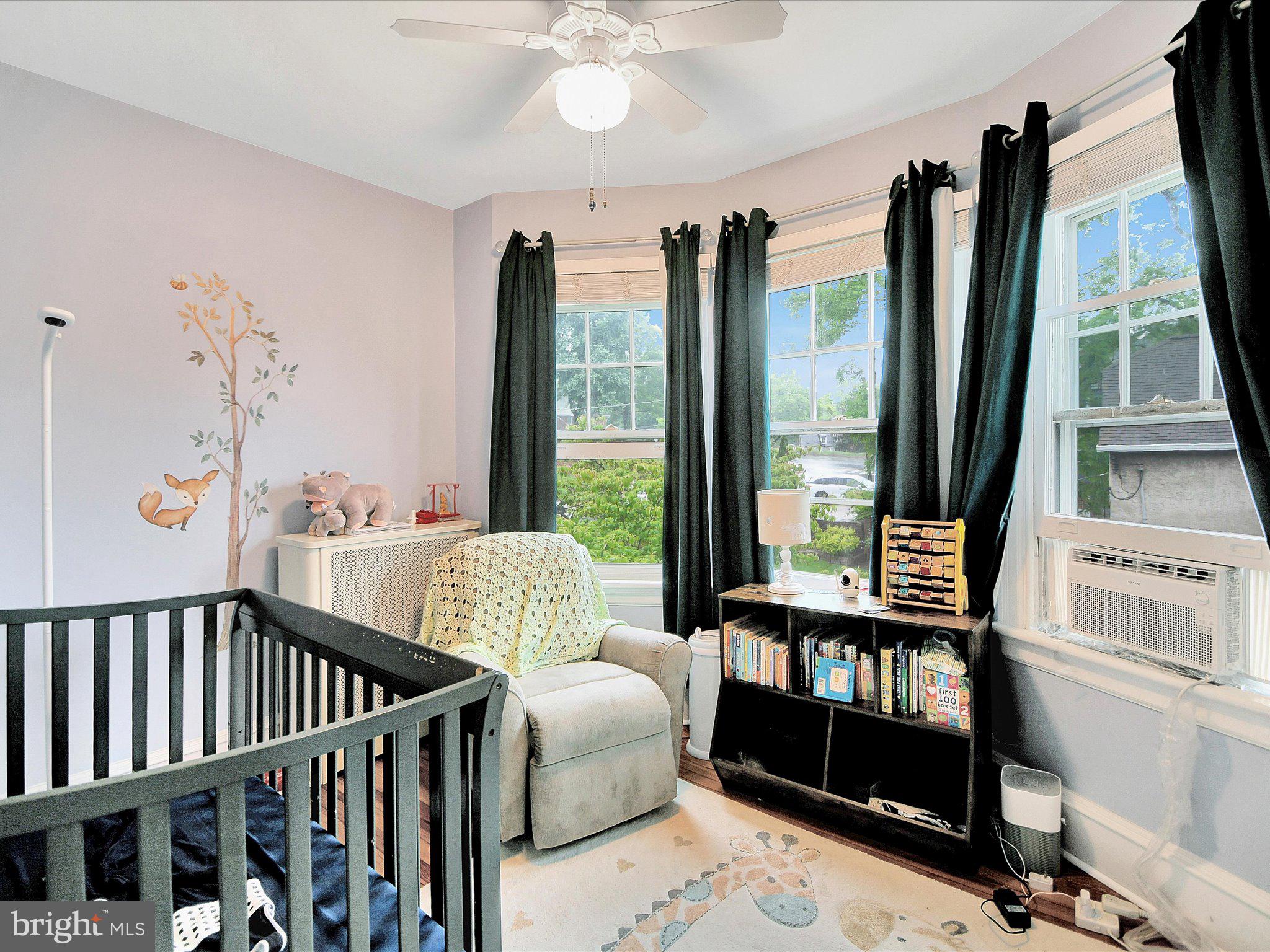 3 Bells Mill Road Glenside, PA 19038 - Photo 18 of 38 a bedroom with furniture and a large window